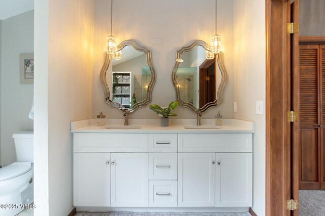 full bath with toilet and double vanity