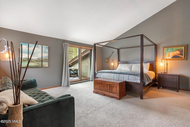 carpeted bedroom with vaulted ceiling, access to outside, and baseboards