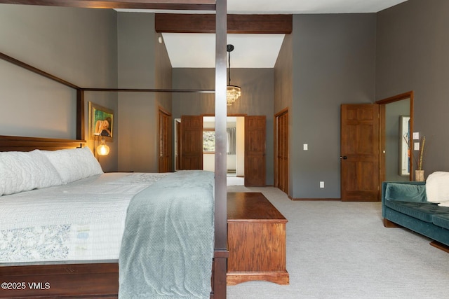 961 June Creek Rd, Edwards, CO 81632 - bedroom featuring a towering ceiling, carpet floors, and a chandelier