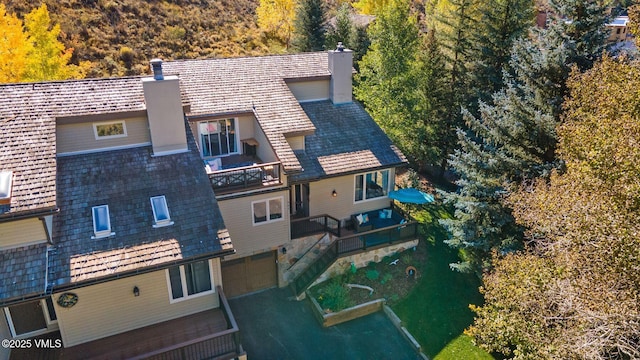 view from above of property with a forest