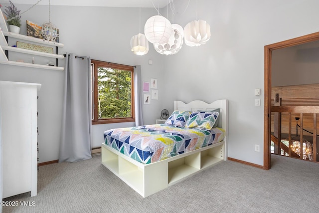 carpeted bedroom with a chandelier and baseboards
