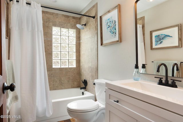 bathroom featuring shower / bath combo with shower curtain, toilet, and vanity