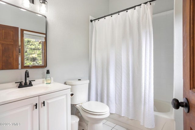 bathroom featuring toilet, vanity, tile patterned flooring, and shower / bath combo with shower curtain