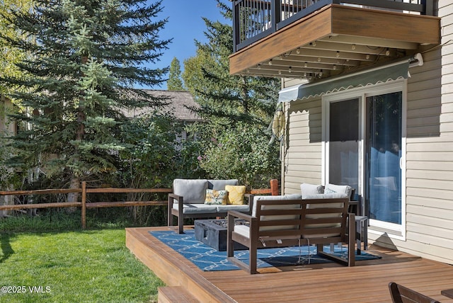 wooden terrace with an outdoor hangout area