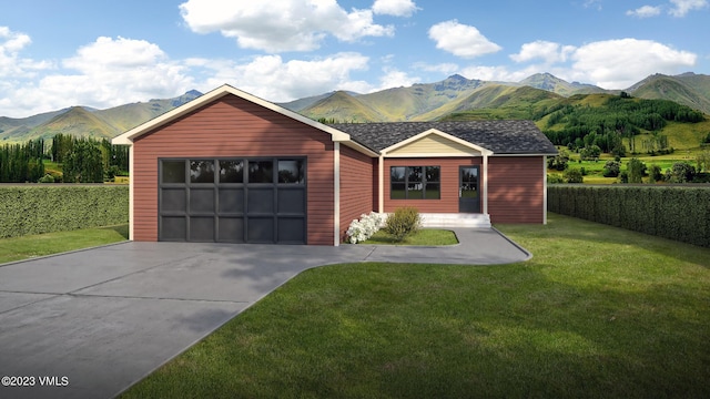 550 Blackhawk Rd, Gypsum, CO 81637 - view of front facade featuring a mountain view, driveway, an attached garage, and a front lawn