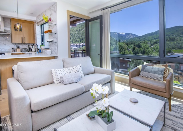 42 Riverfront Ln Unit 304, Avon, CO 81620 - living room featuring plenty of natural light and a mountain view