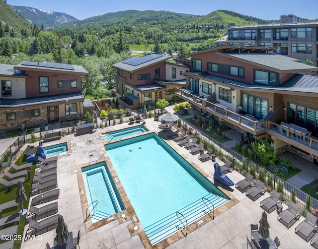 42 Riverfront Ln Unit 304, Avon, CO 81620 - community pool with a community hot tub, a view of trees, and a mountain view