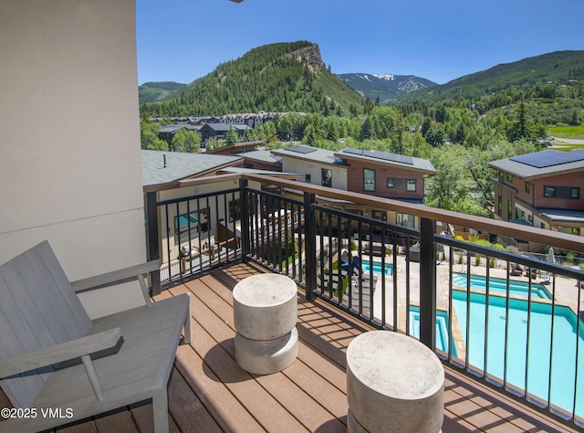 42 Riverfront Ln Unit 304, Avon, CO 81620 - wooden terrace with a mountain view and a wooded view