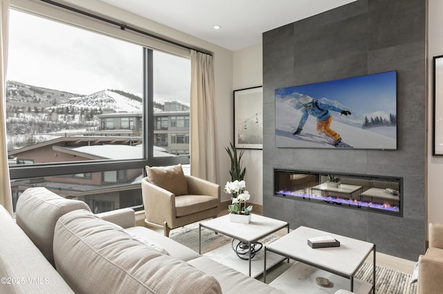 42 Riverfront Ln Unit 304, Avon, CO 81620 - living area with a tile fireplace, recessed lighting, and wood finished floors