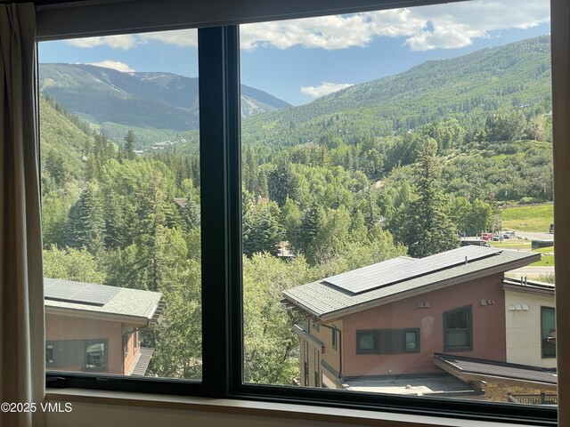 42 Riverfront Ln Unit 304, Avon, CO 81620 - view of mountain backdrop featuring a heavily wooded area