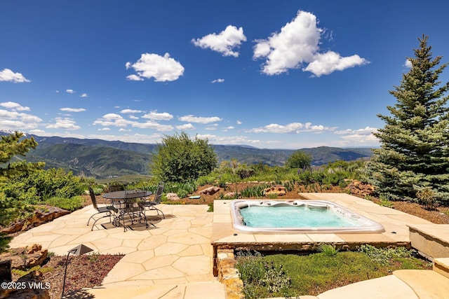 1006 Chiming Bells, Avon, CO 81620 - view of swimming pool with a mountain view, a patio, and an outdoor hot tub