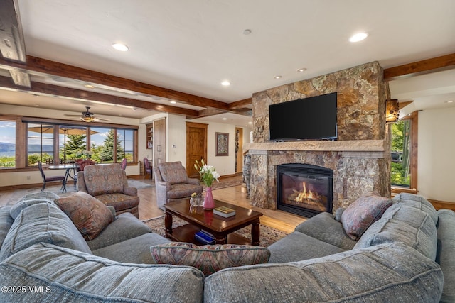 1006 Chiming Bells, Avon, CO 81620 - living area with beamed ceiling, wood finished floors, plenty of natural light, recessed lighting, and a fireplace