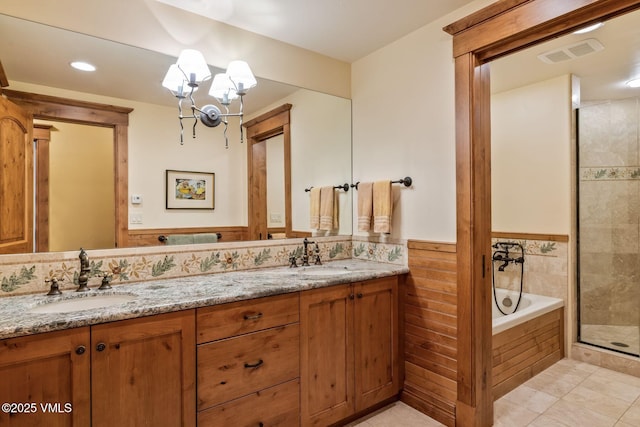 1006 Chiming Bells, Avon, CO 81620 - bathroom featuring double vanity, a stall shower, a garden tub, tile patterned flooring, and recessed lighting