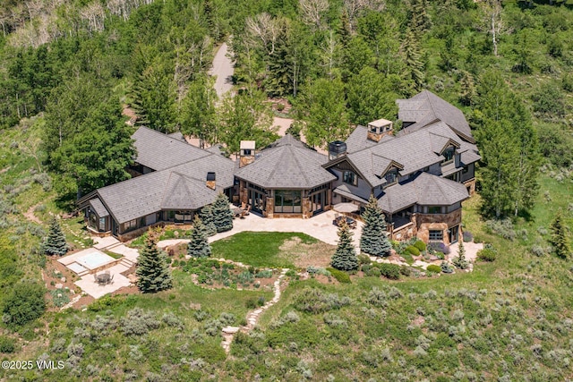 1006 Chiming Bells, Avon, CO 81620 - aerial view of property and surrounding area featuring a heavily wooded area