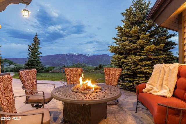 1006 Chiming Bells, Avon, CO 81620 - view of patio / terrace with a mountain view and an outdoor fire pit