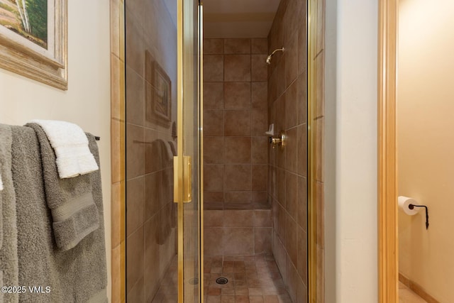 bathroom with a shower stall