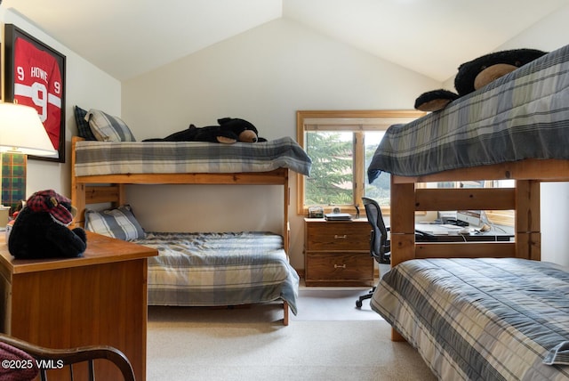 carpeted bedroom featuring vaulted ceiling