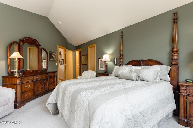 bedroom featuring light carpet and lofted ceiling