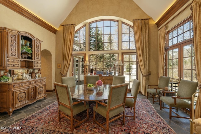 443 Beaver Dam Rd, Vail, CO 81657 - dining room featuring high vaulted ceiling, stone tile flooring, and french doors