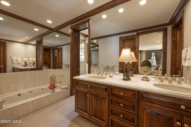 443 Beaver Dam Rd, Vail, CO 81657 - bathroom featuring ornamental molding, double vanity, a garden tub, and recessed lighting
