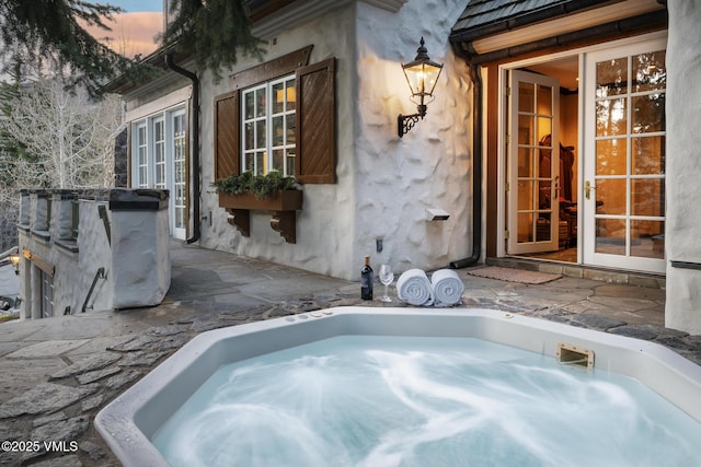 443 Beaver Dam Rd, Vail, CO 81657 - view of patio with a hot tub and french doors