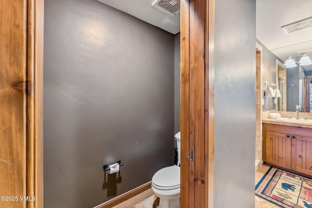 205 Bear Paw Unit B102, Avon, CO 81620 - bathroom featuring toilet, visible vents, tile patterned flooring, and vanity