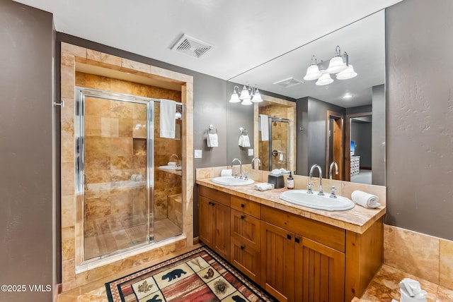 205 Bear Paw Unit B102, Avon, CO 81620 - full bath with visible vents, a sink, and a shower stall