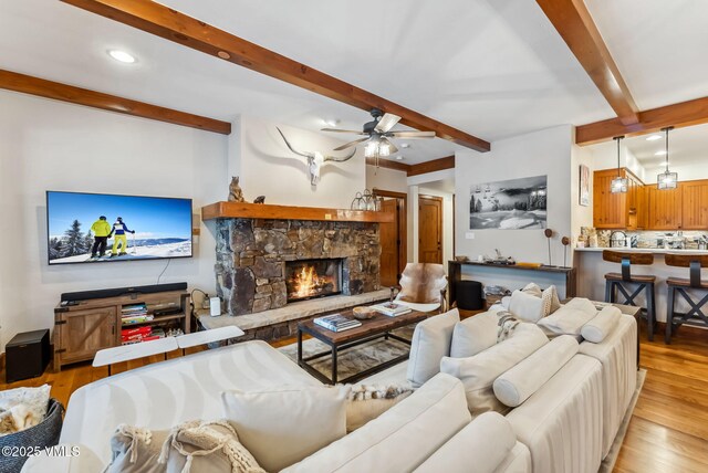 205 Bear Paw Unit B102, Avon, CO 81620 - living room featuring recessed lighting, ceiling fan, wood finished floors, and beamed ceiling