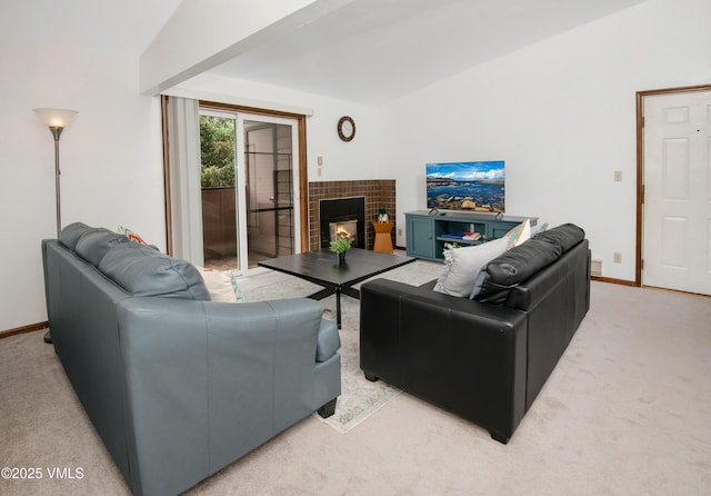 1061 W Beaver Creek Blvd Unit Q302, Avon, CO 81620 - living area featuring light carpet, baseboards, a fireplace, and lofted ceiling