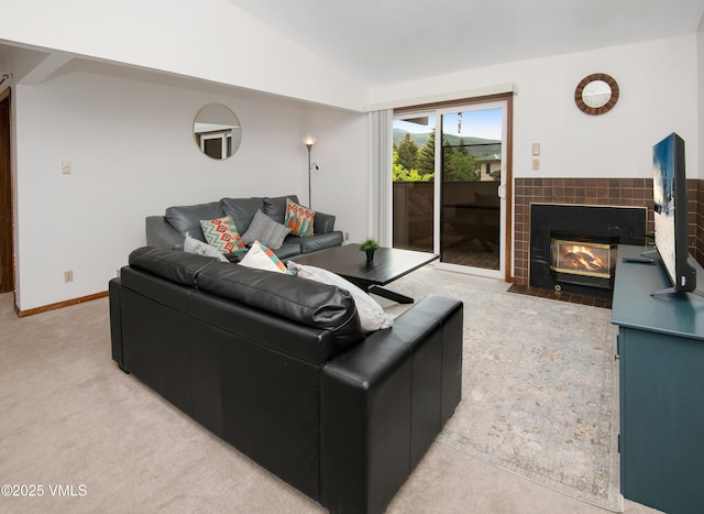 1061 W Beaver Creek Blvd Unit Q302, Avon, CO 81620 - living room featuring lofted ceiling, a tiled fireplace, and light carpet