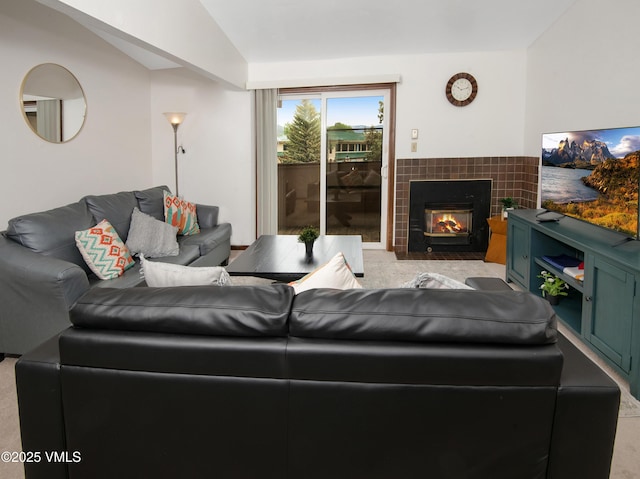 1061 W Beaver Creek Blvd Unit Q302, Avon, CO 81620 - living area featuring light colored carpet, vaulted ceiling, and a tile fireplace