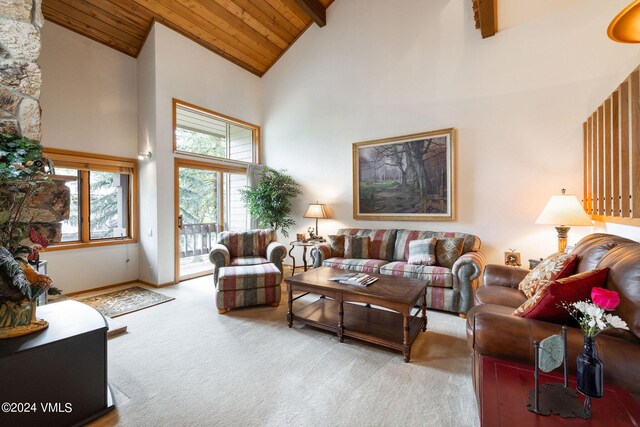 carpeted living room with beam ceiling, high vaulted ceiling, and wooden ceiling