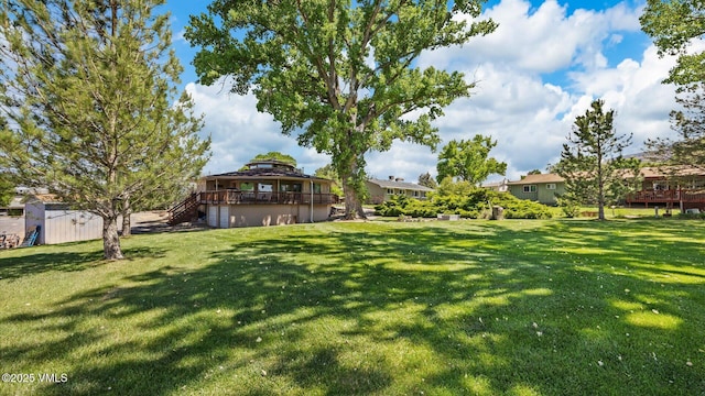 541 20 1/2 Rd, Grand Junction, CO 81505 - view of grassy yard featuring stairs and a deck