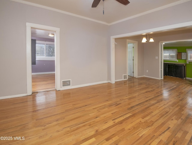 432 W Fifth St, Eagle, CO 81631 - unfurnished living room featuring crown molding, light wood-style flooring, baseboards, and visible vents