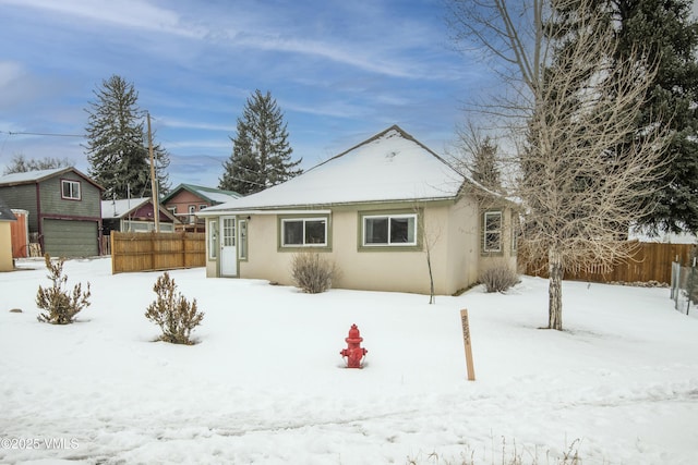432 W Fifth St, Eagle, CO 81631 - snow covered house with stucco siding and fence