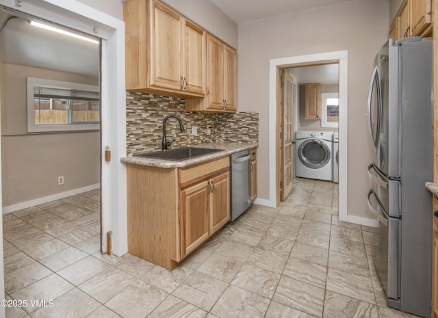 432 W Fifth St, Eagle, CO 81631 - kitchen featuring baseboards, a sink, stainless steel appliances, light countertops, and backsplash