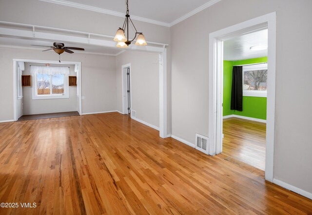 432 W Fifth St, Eagle, CO 81631 - unfurnished dining area with baseboards, light wood-style floors, visible vents, and ornamental molding