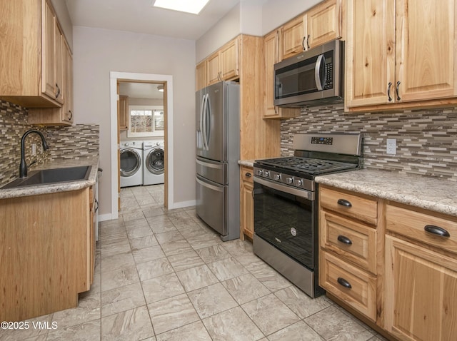 432 W Fifth St, Eagle, CO 81631 - kitchen featuring a sink, light brown cabinetry, light countertops, appliances with stainless steel finishes, and washer and clothes dryer