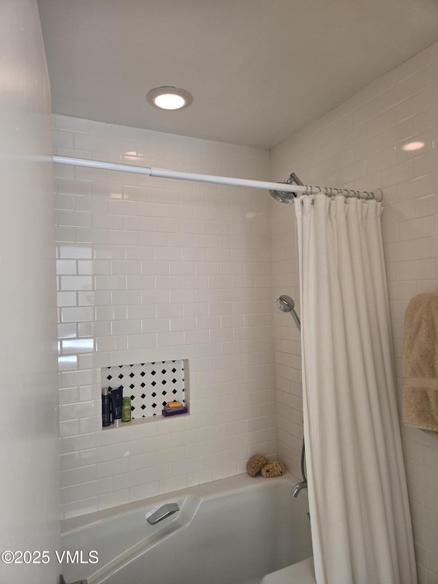 bathroom featuring shower / bath combo with shower curtain