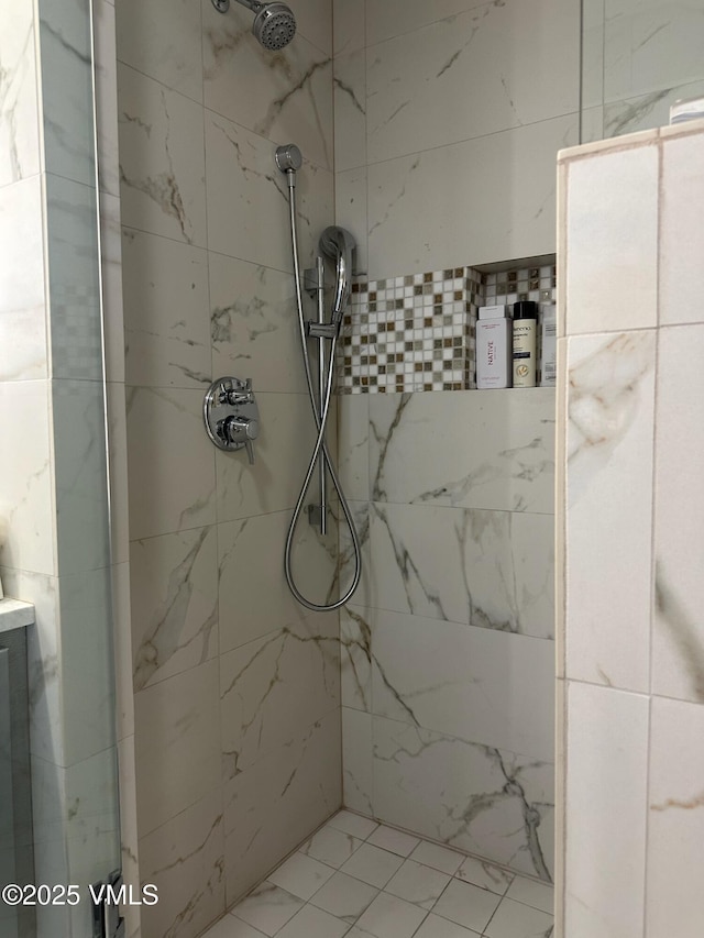 bathroom with tiled shower