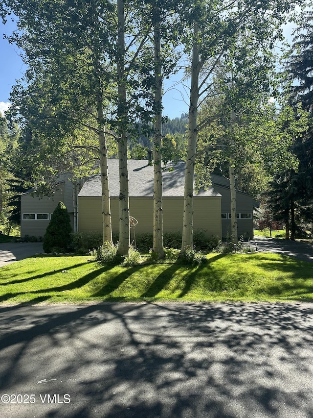 view of home's exterior with a lawn