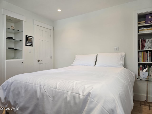 bedroom featuring hardwood / wood-style floors