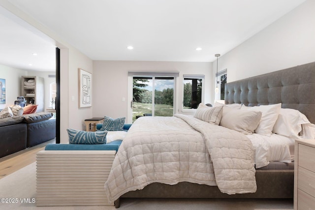 114 Mission Pl, Edwards, CO 81632 - bedroom featuring access to exterior and light hardwood / wood-style flooring