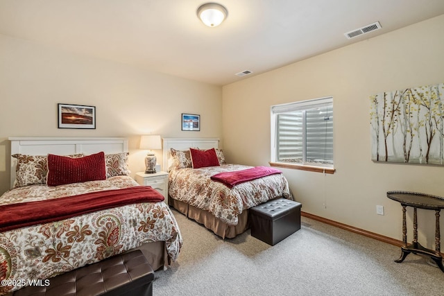 bedroom featuring baseboards, visible vents, and carpet flooring