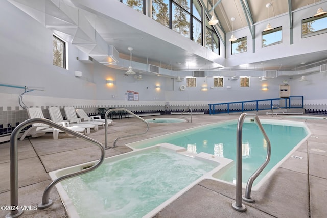 view of swimming pool featuring an indoor in ground hot tub