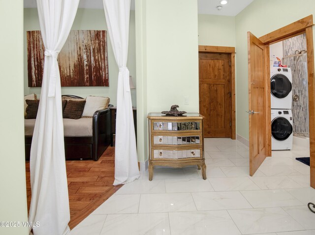 295 Main St Unit R-306, Edwards, CO 81632 - corridor featuring stacked washing machine and dryer and baseboards
