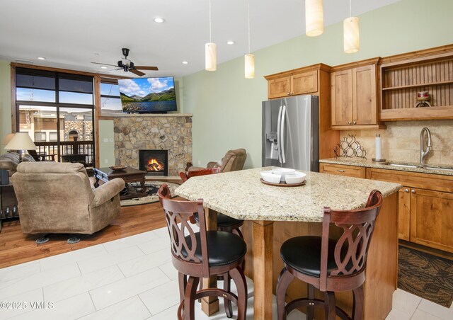 295 Main St Unit R-306, Edwards, CO 81632 - kitchen featuring stainless steel fridge with ice dispenser, a sink, a ceiling fan, open floor plan, and recessed lighting