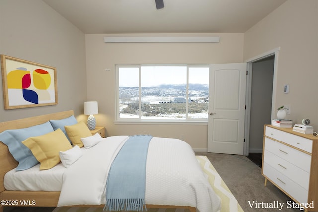 carpeted bedroom with a mountain view