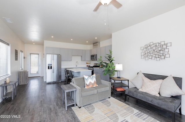 living area featuring dark wood-style floors, recessed lighting, and ceiling fan