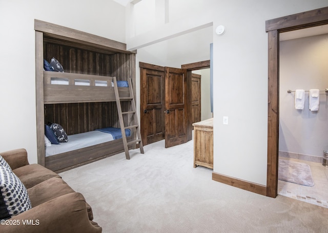 bedroom featuring light carpet